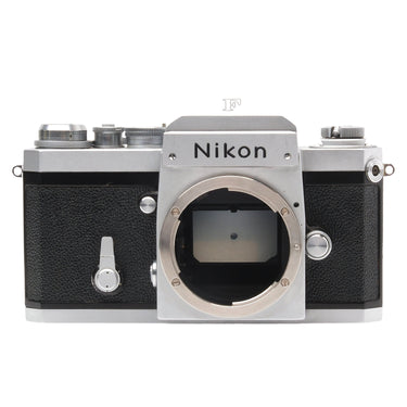Nikon F silver film SLR front view with bare lens mount and Nikon nameplate