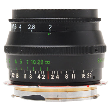 Jupiter-8 50mm f2 lens side view showing aperture and distance scales with bare mount at bottom