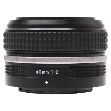 Nikon Z 40mm f2 SE lens side view showing 40mm 1:2 marking and silver ring