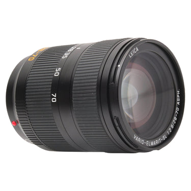 Leica 28-70mm Vario-Elmarit-SL angled view showing front element and zoom scale