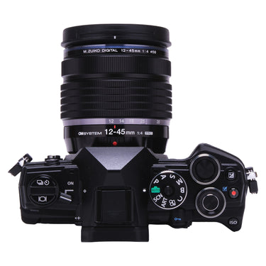 OM System OM-5 top plate with mode dial and 12-45mm f4 PRO lens