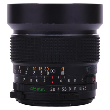 Mamiya Sekor C 45mm f2.8 lens standing upright with built-in hood extended, showing distance and aperture scales