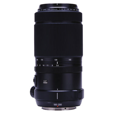 Fujifilm GF 100-200mm f5.6 lens standing upright showing zoom scale and tripod foot