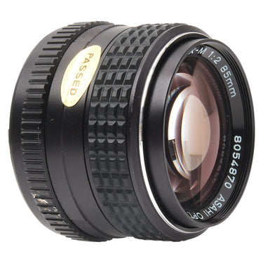 Pentax SMC-M 85mm f2 angled view of front element with PASSED sticker