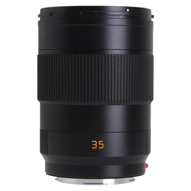 Leica APO-Summicron-SL 35mm f2 lens standing upright, front barrel with focus ring and orange 35 marking
