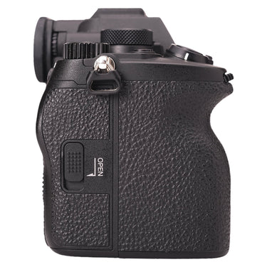 Sony A7R V left side showing card slot door and strap lug