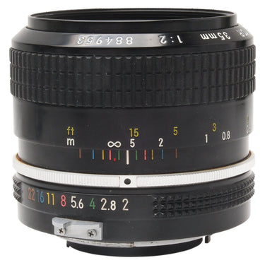 Nikon Nikkor 35mm f2 Non-AI lens side view showing distance scale, aperture ring, and serial number 884953