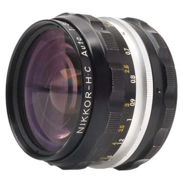 Nikon Nikkor-H.C 28mm f3.5 front three-quarter view with Nikkor-H.C Auto barrel engraving