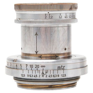 Leica 5cm f2 Summar lens side view showing aperture scale and heavily scratched chrome barrel