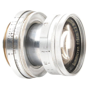 Leica 5cm f2 Summicron front three-quarter view, extended, showing front glass and aperture ring