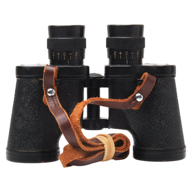 Nikon 6x30 binoculars eyepieces with diopter scales and coiled leather strap