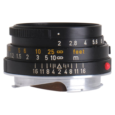 Leica 40mm f2 Summicron-C side view showing aperture and depth-of-field scales with red index
