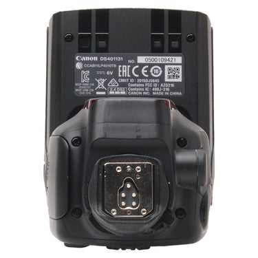 Canon Speedlite bottom with hot shoe foot, serial number, and specification label