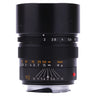 Leica 90mm f2 Summicron-M front view with built-in hood extended and aperture and distance scales