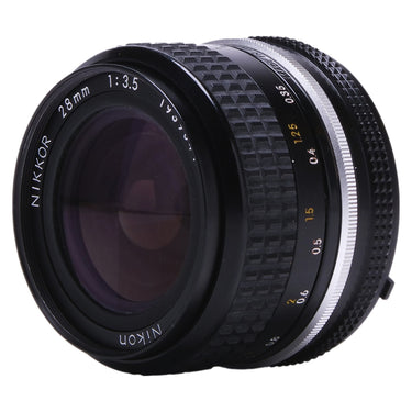 Nikon 28mm f3.5 lens angled view showing distance scale and Made in Japan markings