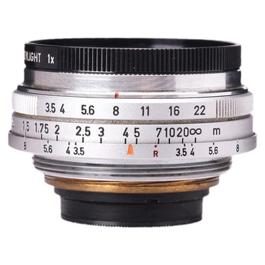 Canon 25mm f3.5 lens side view showing aperture and distance scales