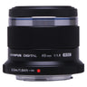 Olympus M.Zuiko Digital 45mm f1.8 side view showing barrel markings and focus scale