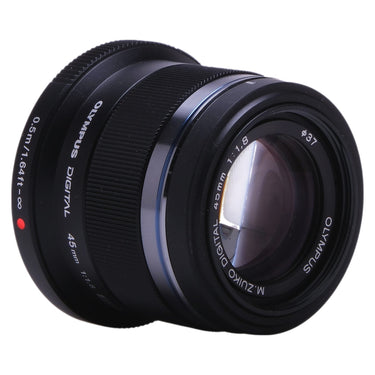 Olympus 45mm f1.8 angled front view of front glass and focus ring