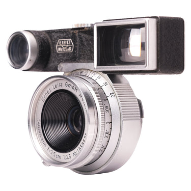 Leica Summaron 3.5cm f3.5 M3 front three-quarter view with goggle attachment and distance scale