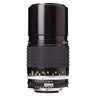 Nikon 200mm f4 AI-S Nikkor lens standing upright with built-in hood extended and distance scale