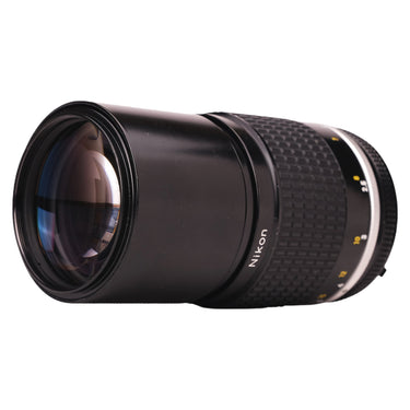 Nikon 200mm f4 Nikkor side view with front glass and Nikon badge