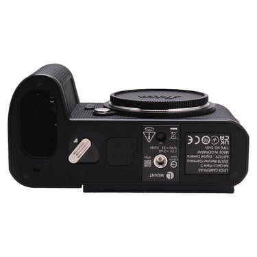 Leica SL3 bottom plate with body cap, battery bay, tripod socket, and serial label 6011129