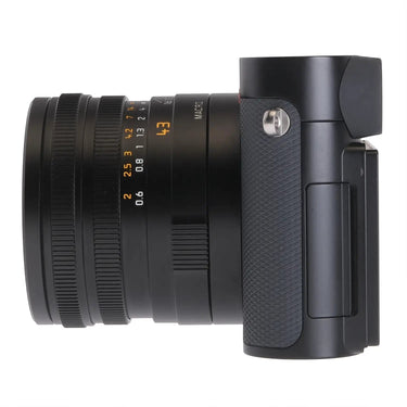 Camera West Leica Q3 43 digital camera side view showing the black lens barrel and textured grip