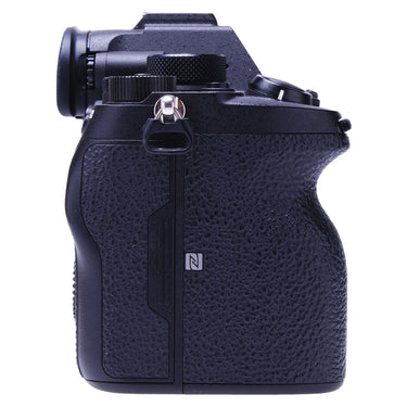 Sony A7R IV left side showing textured grip and NFC mark