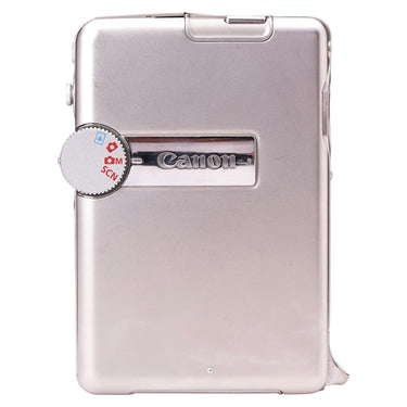 Canon PowerShot TX1 back panel with mode dial and Canon logo