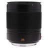 Leica Summilux-TL 35mm f1.4 standing upright with hood, showing focus ring and orange 35 marking
