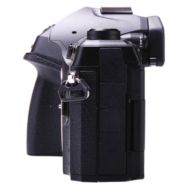 Olympus OM-1 left side showing HDMI and USB port covers