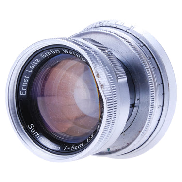 Leica Summicron collapsible front element at an angle showing coating and cleaning marks