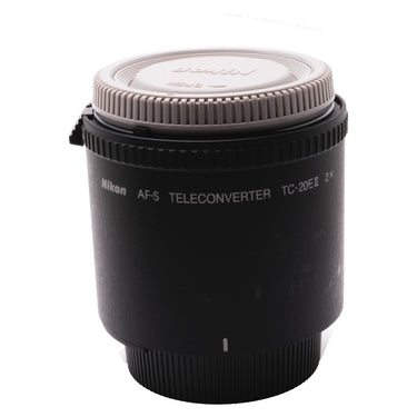 Nikon TC-20E II teleconverter standing upright with gray rear cap fitted