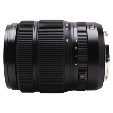 Fujifilm GF 32-64mm lens side view with aperture ring and A/C switch