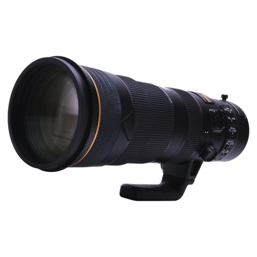 Nikon 180-400mm f4E lens three-quarter front view with built-in hood extended