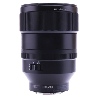 Sony FE 135mm f1.8 GM side view showing serial number and de-click switch