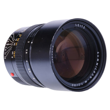 Leica 90mm f2 Summicron-M front three-quarter view with aperture and depth-of-field scale