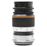 Leica 9cm f4 Elmar lens standing upright, aperture scale at top and screw mount base at bottom