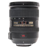 Nikon AF-S 18-200mm VR DX lens standing upright, front cap on top and F mount at base