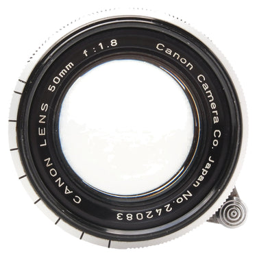 Canon 50mm f1.8 front element with engraved name, focal length, and serial number 242083