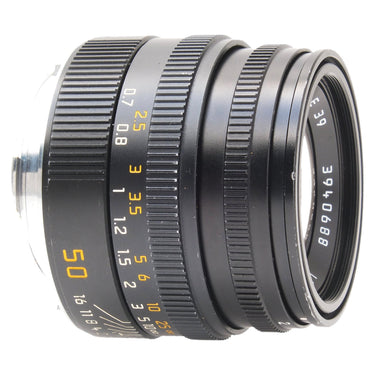 Leica 50mm Summicron-M side view showing focus scale and engraved serial number
