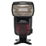 Nikon Speedlight SB-910 front view with flash head and body on tabletop stand