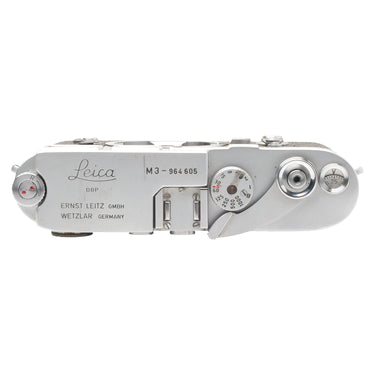Leica M3 top plate with Leica engraving, serial number 964605, and shutter speed dial