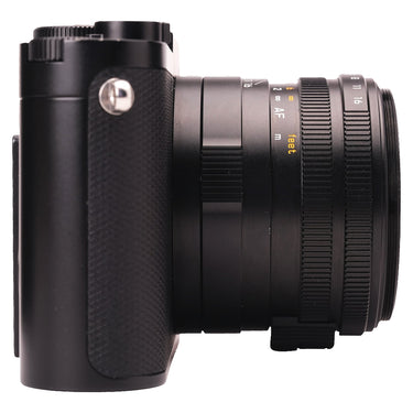 Leica Q3 left side showing textured grip and extended lens barrel