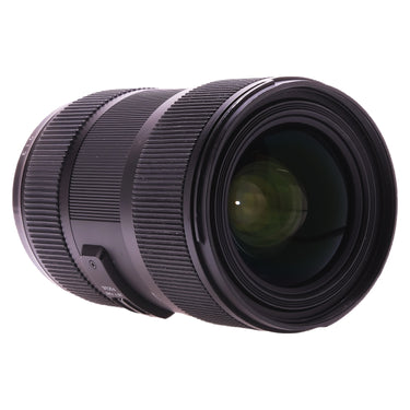 Sigma 18-35mm f1.8 DC Art angled view showing front glass and AF/MF focus switch