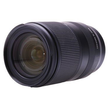 Tamron 18-300mm lens angled front view showing front glass and zoom barrel