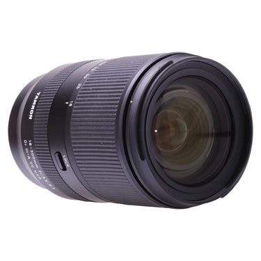 Tamron 18-300mm lens angled view of front element and zoom ring with focal length scale