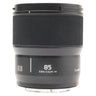 Panasonic Lumix S 85mm f1.8 lens standing upright with hood mounted, showing 85 focus distance markings