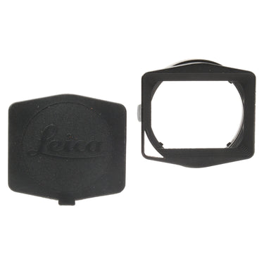 Leica 12592 metal lens hood beside its Leica snap-on cover