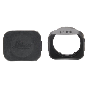 Leica 12526 lens hood beside its rubber hood cover with Leica logo